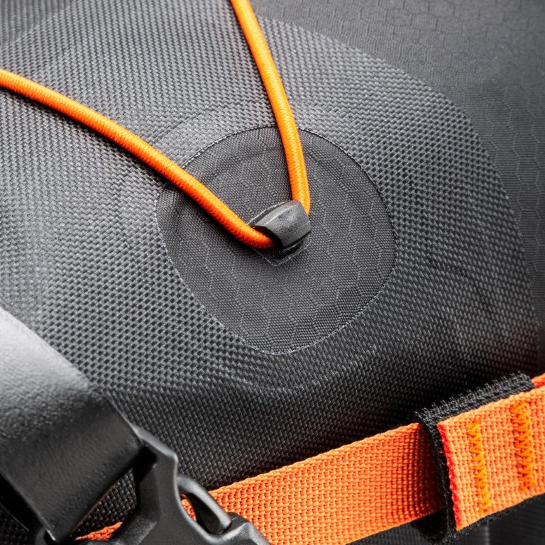 One of the fastening points for the elastic cord which you can use to carry extra items on the outside of the seat-pack. The glued area of reinforcement means the pack stays waterproof.